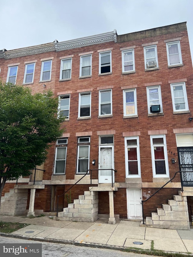 view of property featuring brick siding