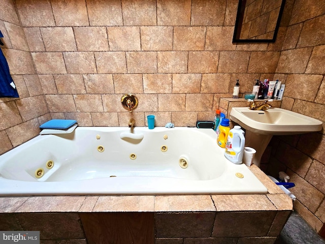 bathroom featuring tiled bath