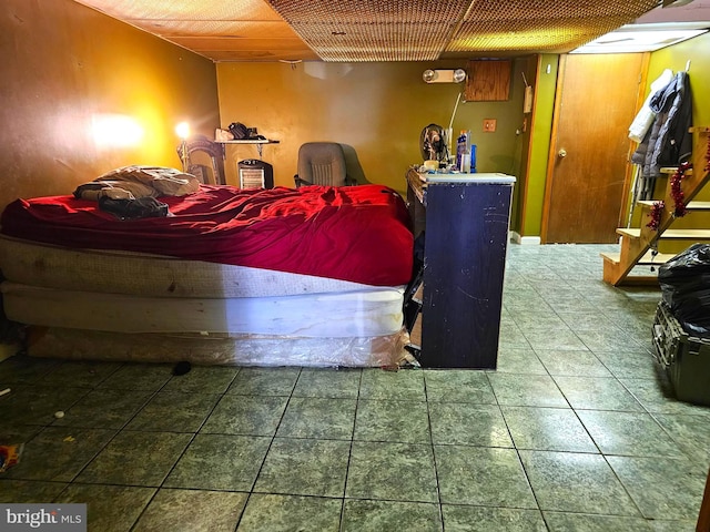 bedroom featuring tile patterned flooring