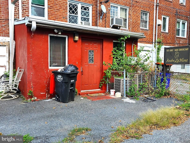 doorway to property featuring cooling unit