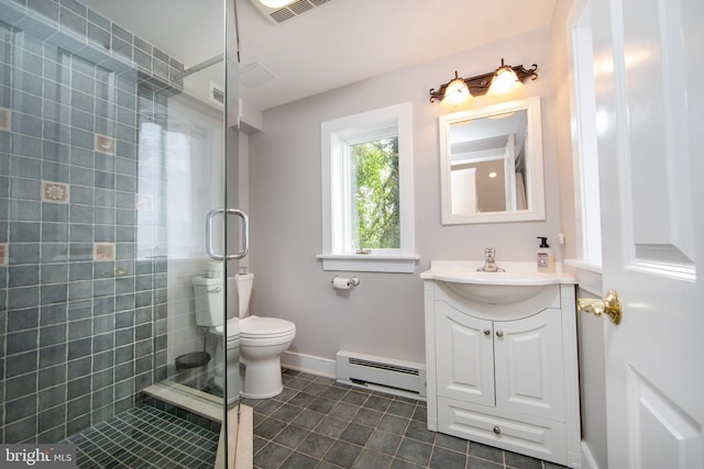 bathroom with vanity, toilet, a baseboard radiator, and a shower with door