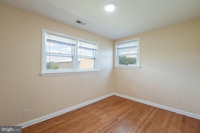 spare room featuring hardwood / wood-style flooring