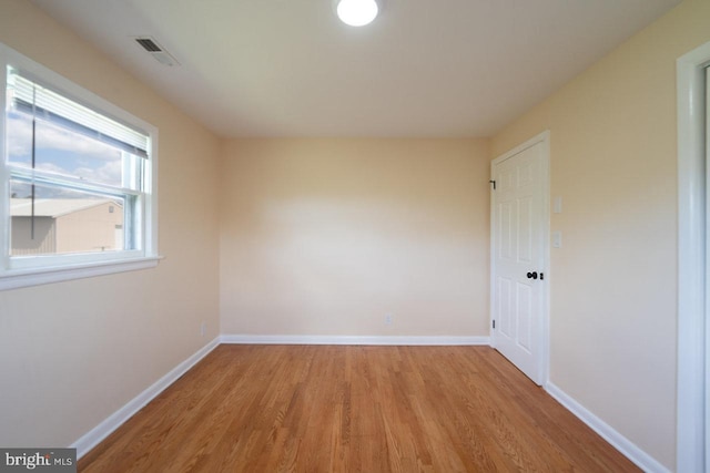 empty room featuring wood-type flooring