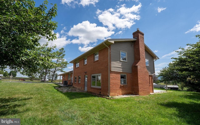 view of property exterior with cooling unit and a yard