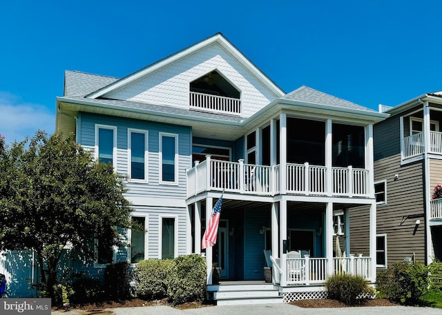 view of front facade with a balcony and covered porch