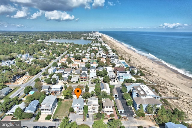 bird's eye view with a view of the beach, a residential view, and a water view