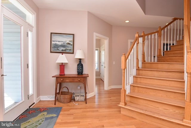 entryway with light hardwood / wood-style floors and a wealth of natural light