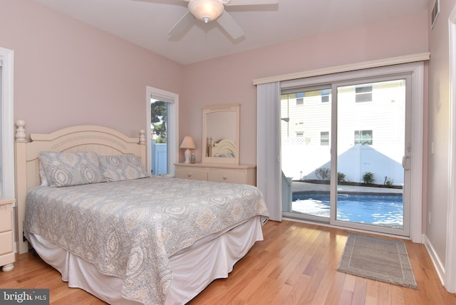 bedroom with ceiling fan, light hardwood / wood-style floors, multiple windows, and access to outside