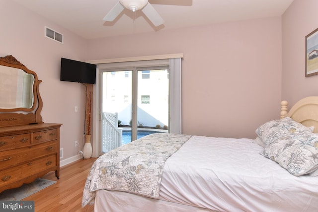 bedroom featuring visible vents, baseboards, a ceiling fan, access to outside, and light wood-style floors