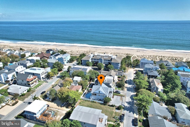 bird's eye view featuring a residential view, a water view, and a beach view