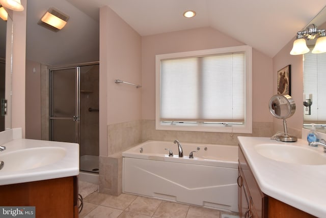 bathroom with vanity, lofted ceiling, and separate shower and tub