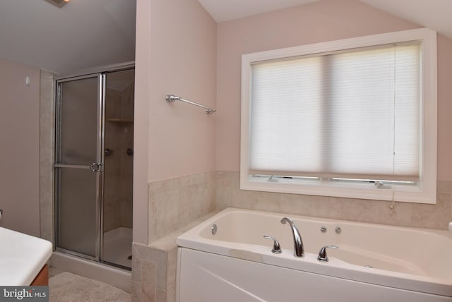 bathroom with vanity and separate shower and tub