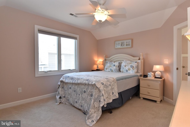 bedroom featuring vaulted ceiling, ceiling fan, and light colored carpet