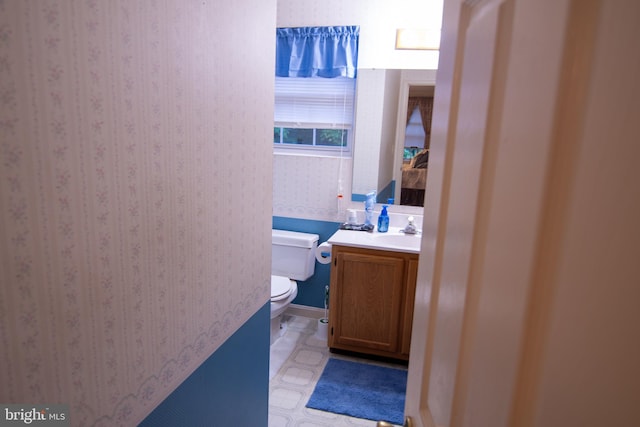 bathroom featuring vanity and toilet