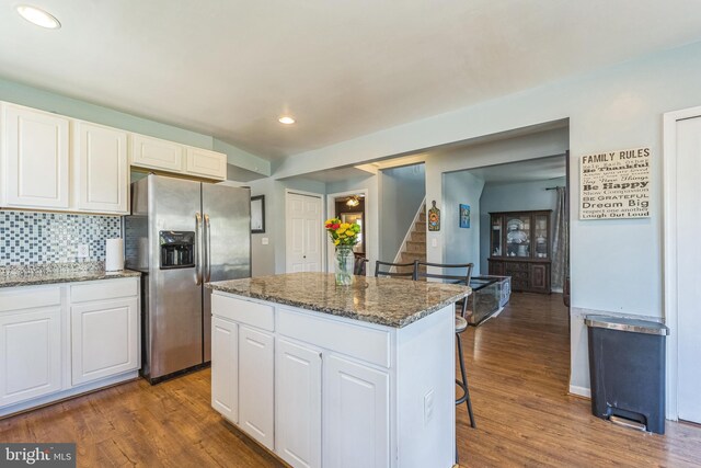 kitchen featuring light wood-type flooring, stainless steel appliances, white cabinetry, and french doors