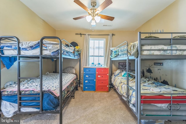 bedroom featuring ceiling fan and carpet