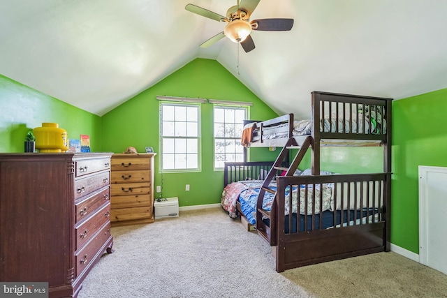 bedroom featuring vaulted ceiling, light colored carpet, and ceiling fan