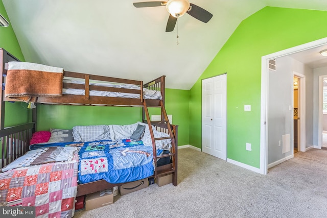 bedroom with vaulted ceiling, ceiling fan, and carpet