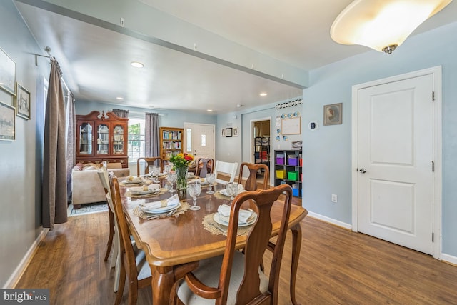 dining space featuring dark hardwood / wood-style flooring