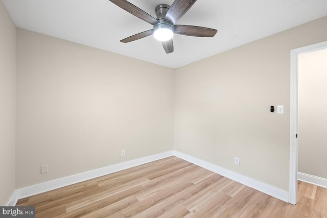 empty room featuring ceiling fan and light hardwood / wood-style floors