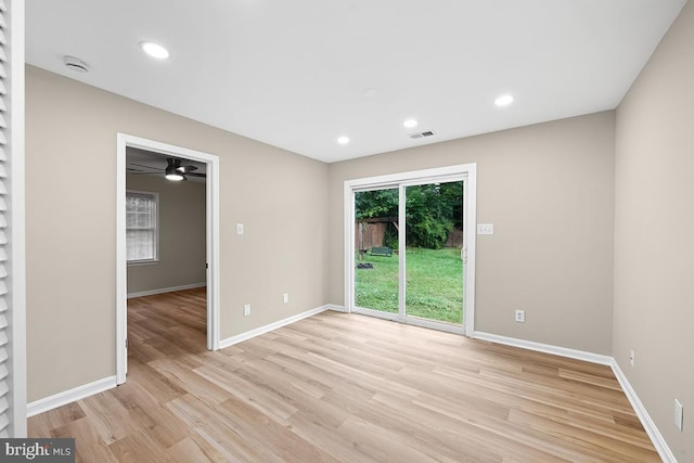 unfurnished room with light hardwood / wood-style floors and ceiling fan