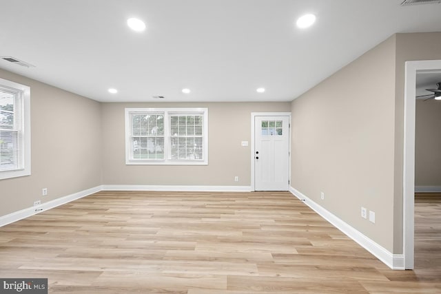 entryway with light hardwood / wood-style flooring and ceiling fan