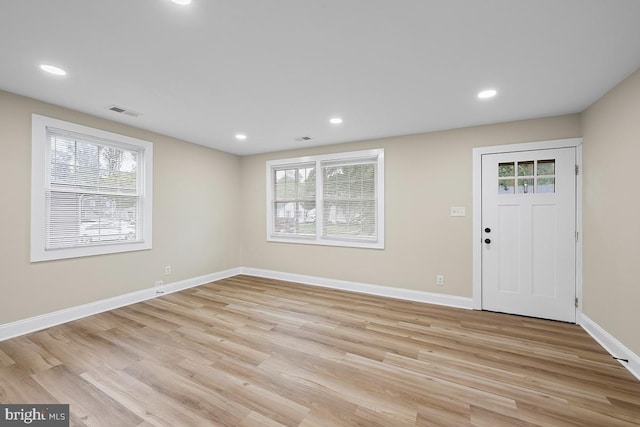 foyer featuring a healthy amount of sunlight and light hardwood / wood-style floors