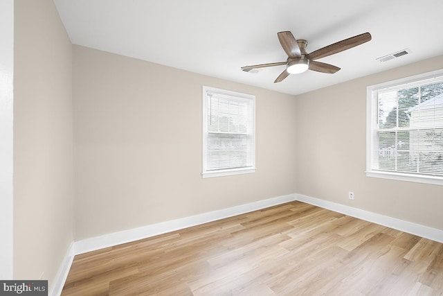 unfurnished room with ceiling fan and light hardwood / wood-style flooring