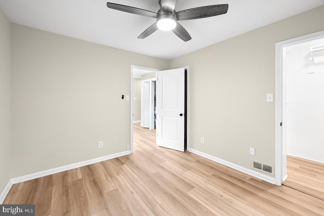 unfurnished bedroom featuring ceiling fan and light wood-type flooring