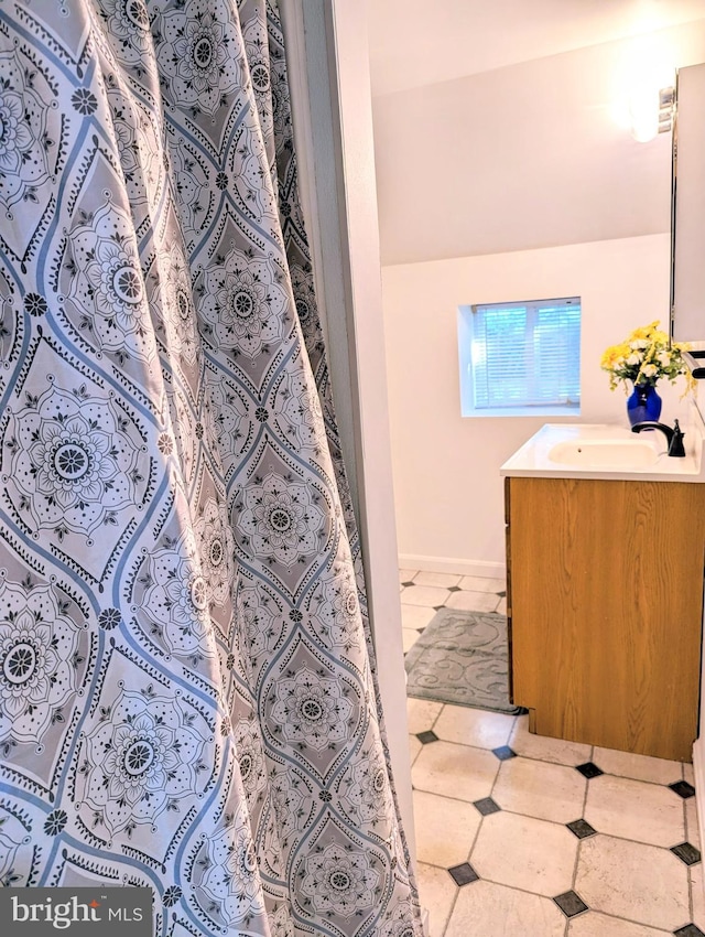 bathroom with vanity and tile patterned flooring