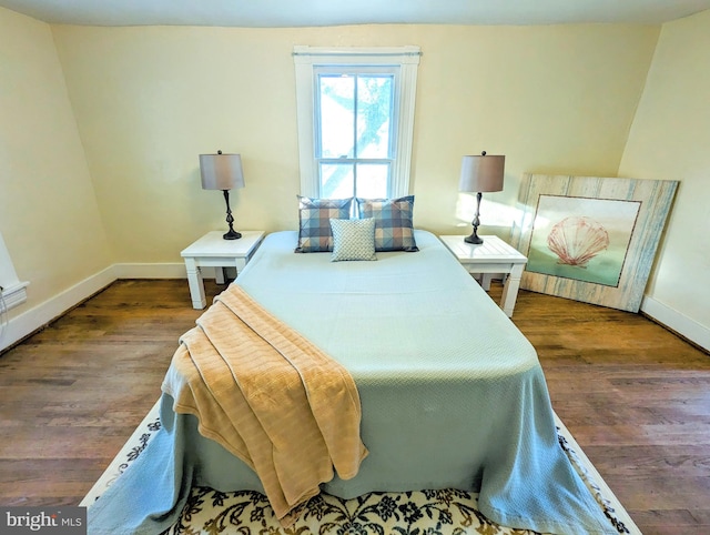 bedroom featuring dark hardwood / wood-style floors