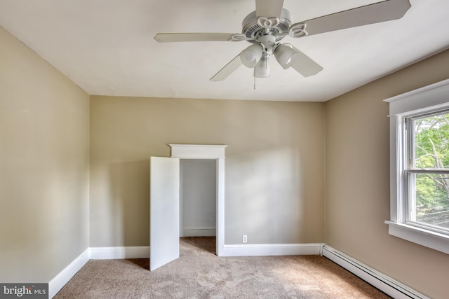 unfurnished bedroom featuring a baseboard radiator, baseboards, carpet flooring, and baseboard heating