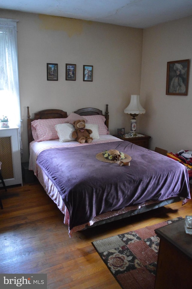 bedroom featuring wood finished floors