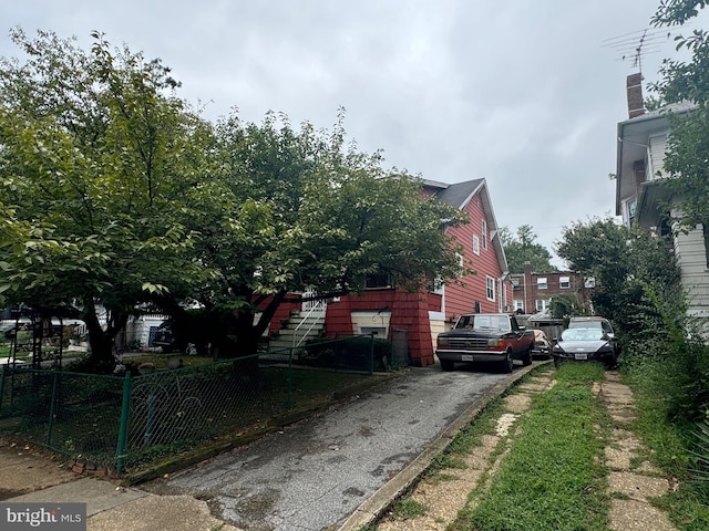 view of home's exterior featuring fence