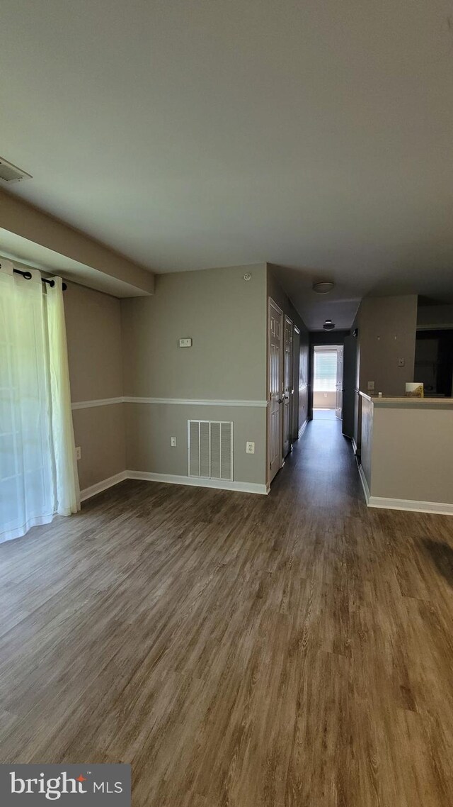 unfurnished room featuring hardwood / wood-style floors