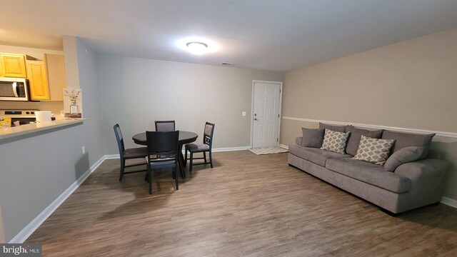 living room featuring dark hardwood / wood-style floors