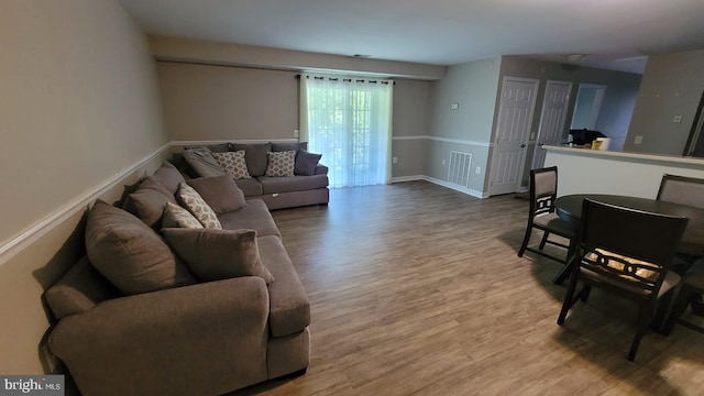 living room with light hardwood / wood-style flooring