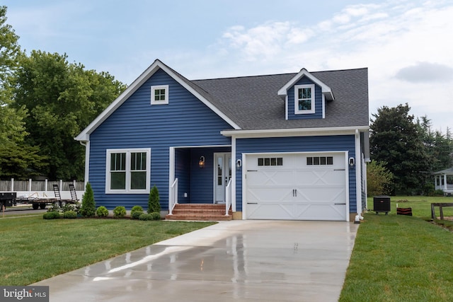 view of front of house with driveway, a shingled roof, central AC unit, and a front yard