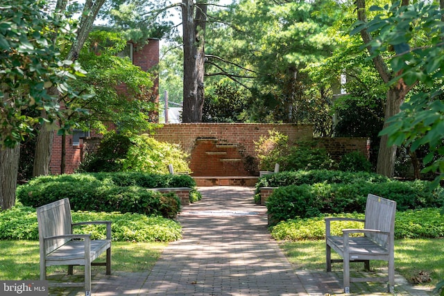 view of community featuring fence