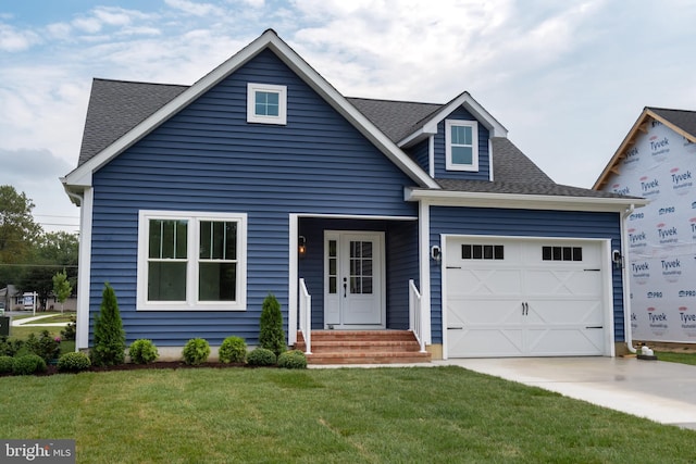 view of front facade featuring a front yard and a garage