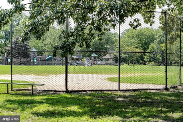 view of community with a lawn and a playground