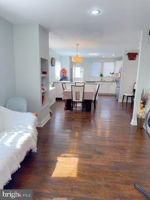 living room with dark wood-type flooring