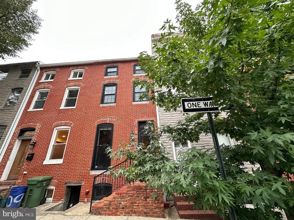 view of front of house with brick siding