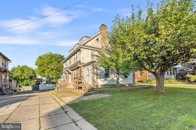 view of front of home with a front yard