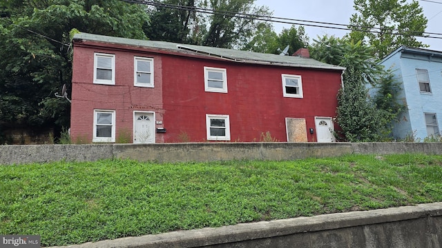 358-360 Bedford St, Cumberland, MD 21502 - view of front of property with a front lawn and a chimney