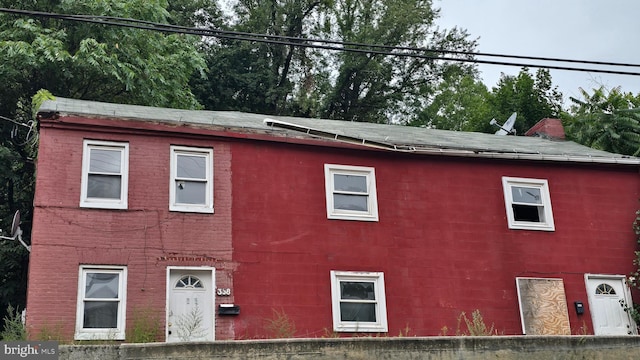 view of property exterior with concrete block siding