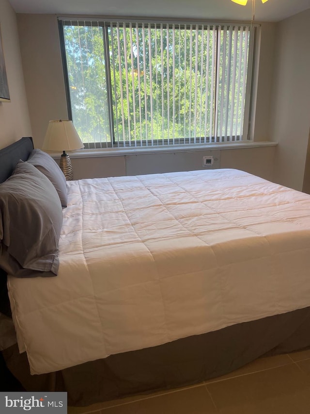 bedroom with tile patterned floors