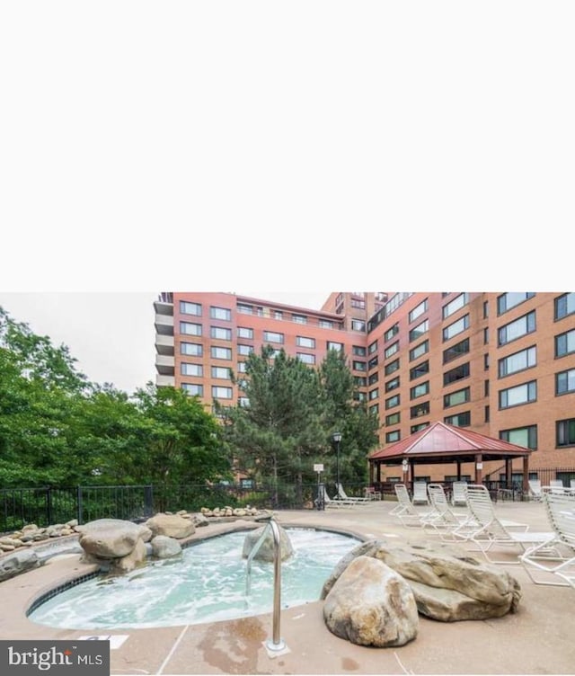 view of swimming pool featuring a gazebo