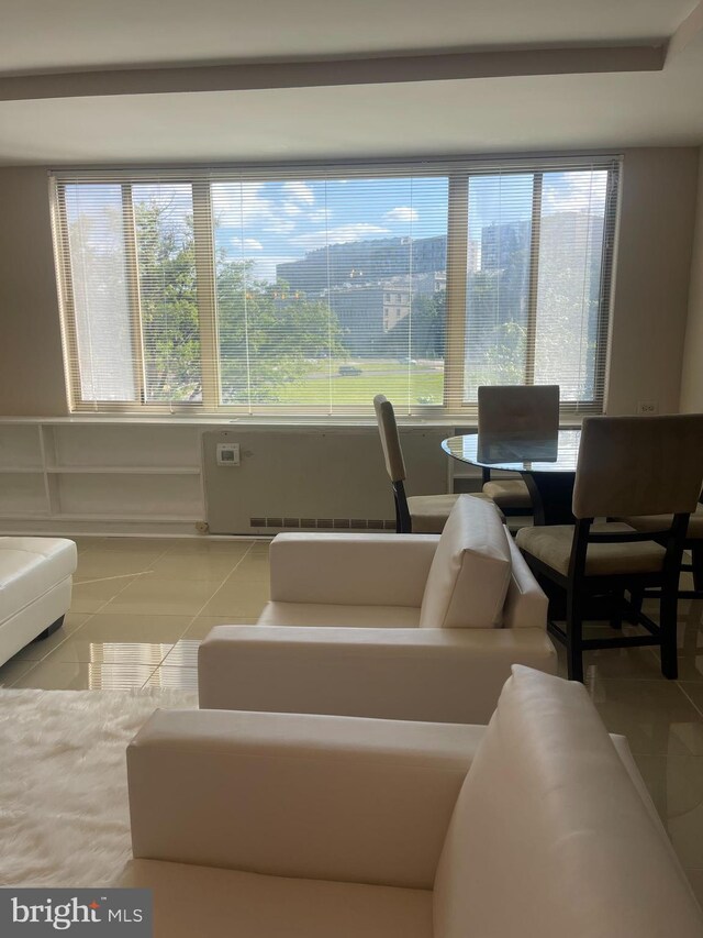 dining area featuring tile patterned flooring