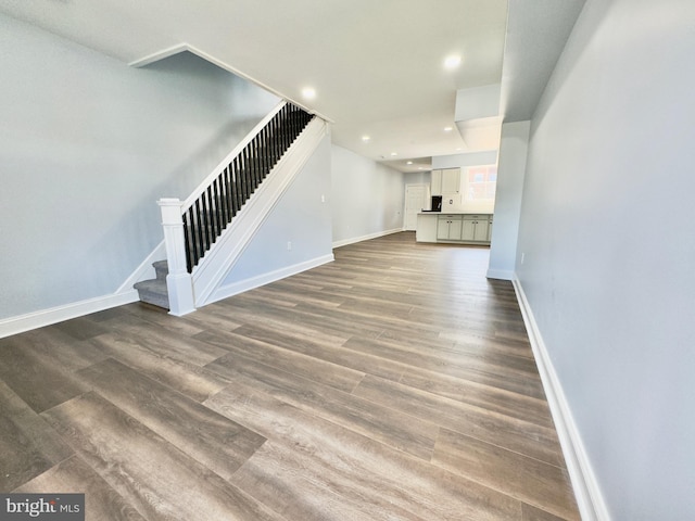 unfurnished living room with dark hardwood / wood-style floors